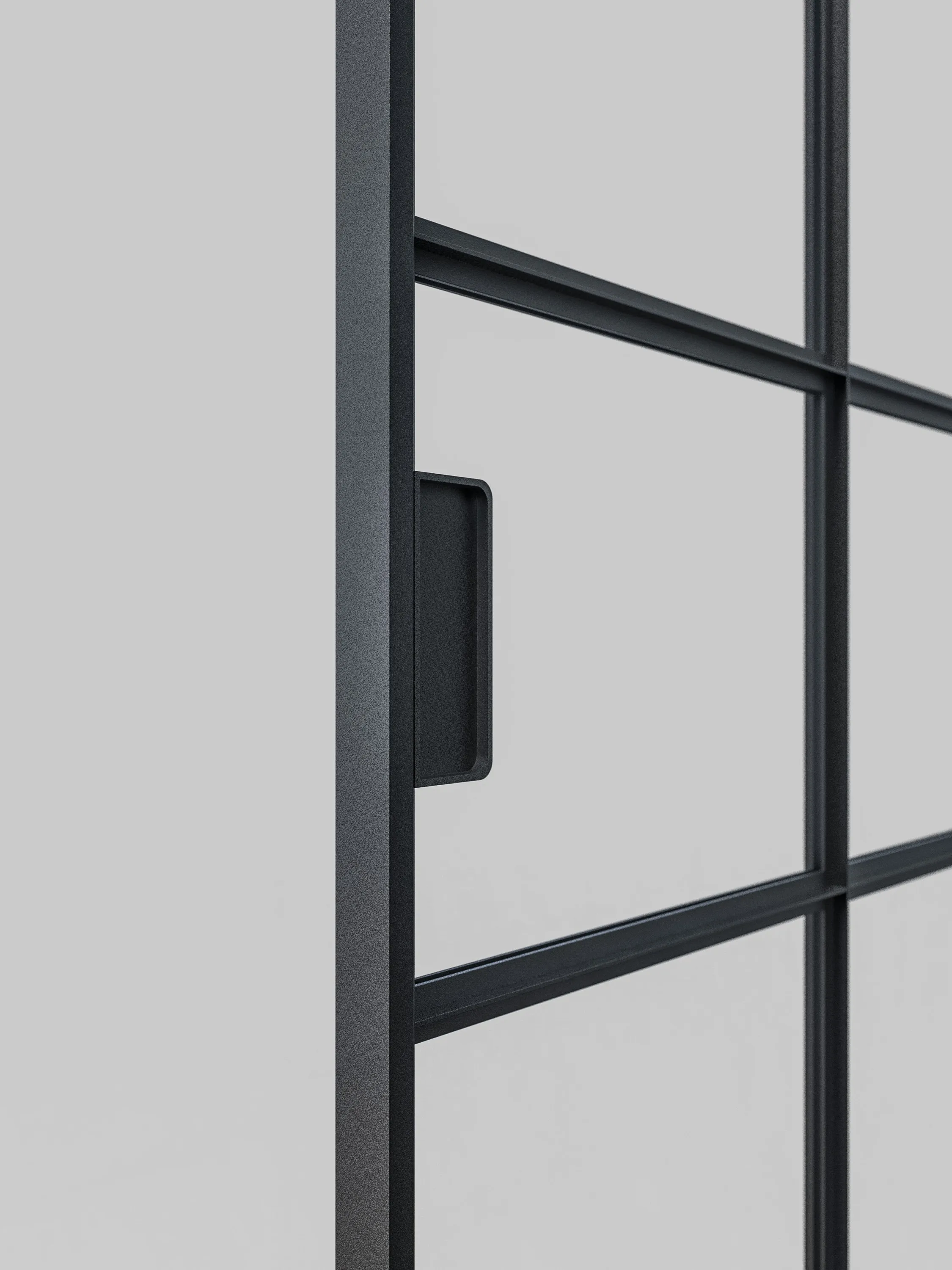 Schwarze Griffschale aus Aluminium, bündig mit der Türfläche, an einer Loft-Schiebetür.
